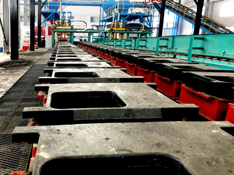 Application of fully automatic horizontal parting molding production line in the production of cast iron pipe fittings